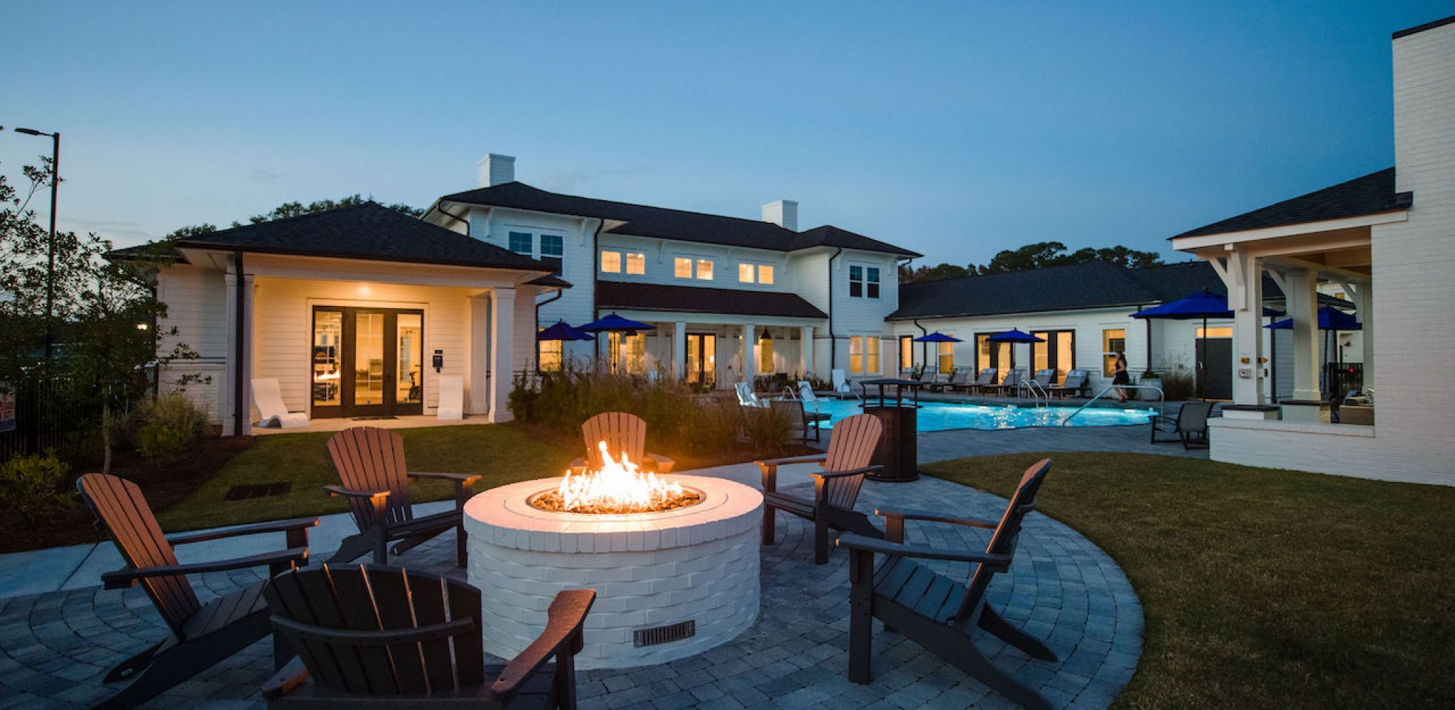 Hawthorne at the Pointe luxury outdoor pool area with fire pit and Adirondack chairs