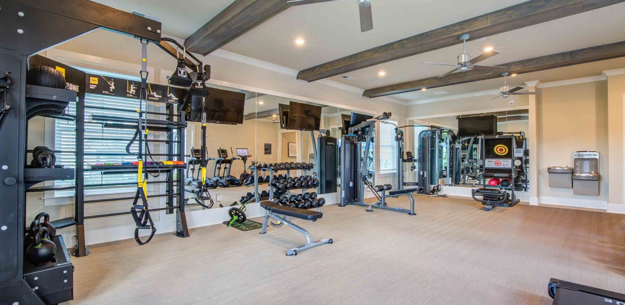 Hawthorne at the Pointe resident fitness center amenity with strength training equipment and cardio machines