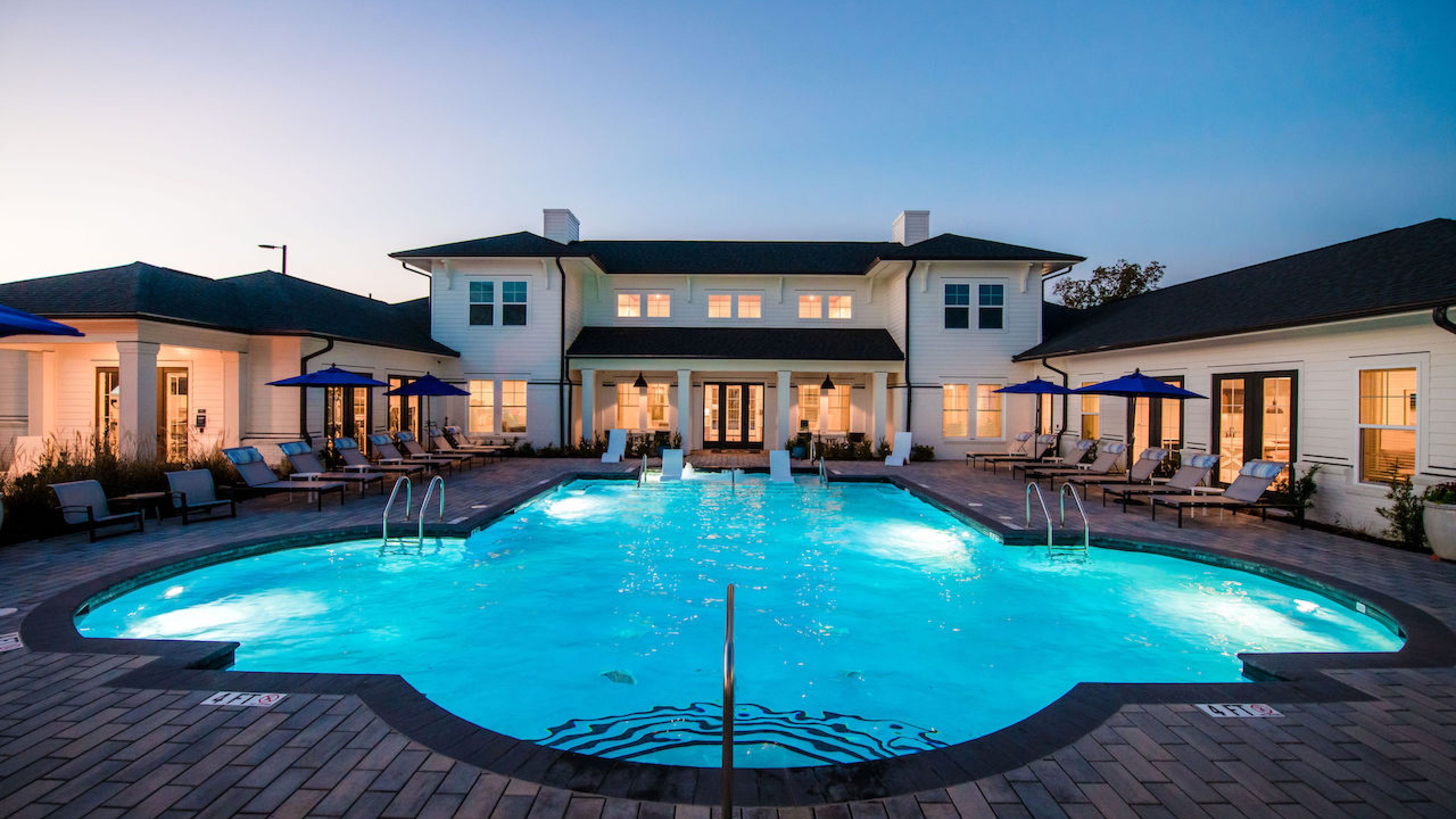 Hawthorne at the Pointeluxury outdoor pool with in-pool lounge chairs and surrounding seating