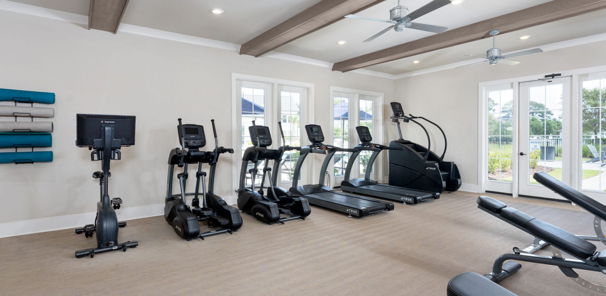 Hawthorne at the Pointe resident fitness center amenity with strength training equipment and cardio machines